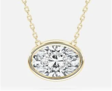 East-west oval bezel set lab-grown diamond pendant on a yellow gold chain