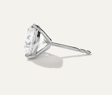 Side profile of a diamond stud earring showing the martini setting and post